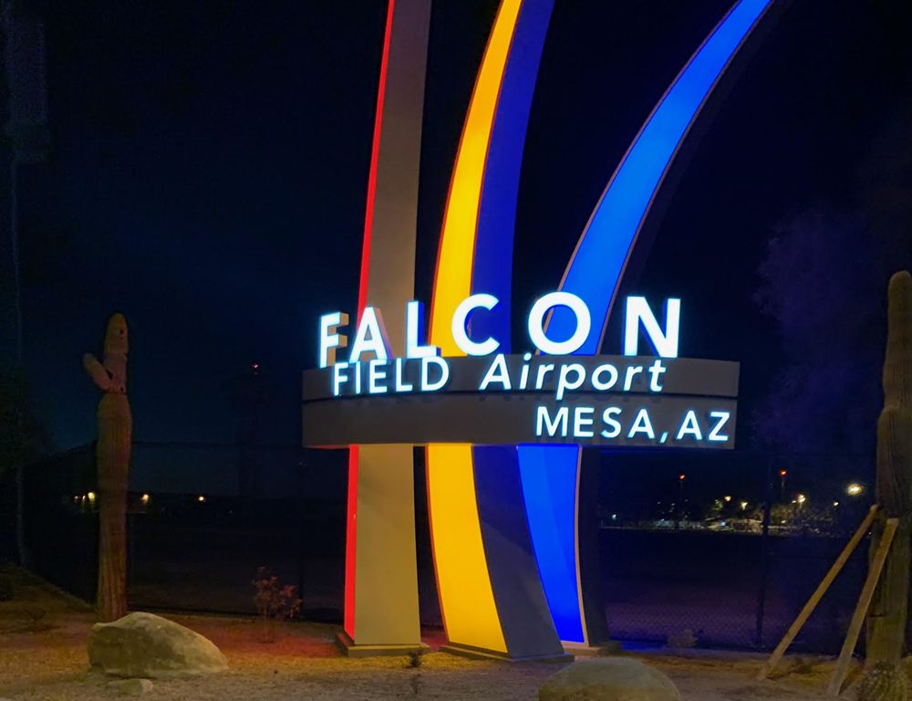 A sign that says falcon field airport in mesa, az.