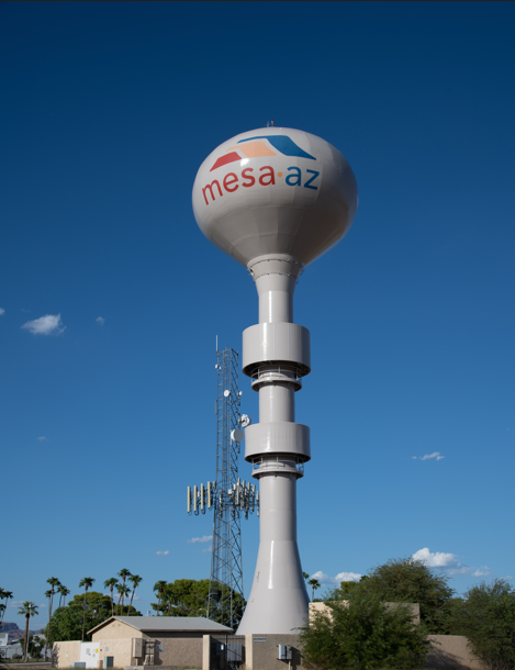 A white water tower with the words mesa az on it.